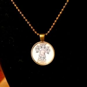 Round glass pendant cross necklace with chain. Blue and cream cross